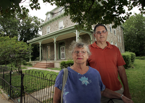 Mary Ellen Graham and Joseph Clay , president and vice president of My Place Germantown, stand outside St. Vincent's Convent in Germantown. Advocates for the homeless had hoped to convert the former convent into 12 permanent efficiency apartments.