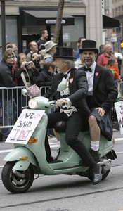 A couple in wedding attire take part in San Francisco's 38th annual gay-pride parade. The state Supreme Court legalized same-sex marriage on June 16.