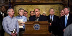 Gov. Rendell, flanked by lawmakers, speaks about the state budget deal reached early yesterday in Harrisburg. Rendell said the $28.2 billion spending plan advances infrastructure and energy needs.
