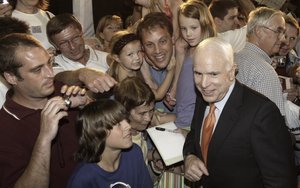 Supporters take delight in the chance to get close to Republican presidential candidate Sen. John McCain after a town hall-style meeting yesterday in Pipersville, Pa.
