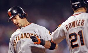 Phillies seem to miss the presence of Aaron Rowand, being congratulated after homering on Giants' May visit to Citizens Bank Park.