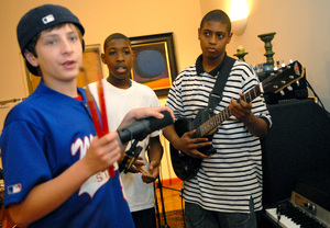Leonard Nelson Hubbard's audience at Philadelphia's Sine Studios includes students (from left) Reuben Kickstein, 14, a singerand drummer; Martin Wesby, 15, a drummer; and Amir Handy, 13, a guitarist. The young musicians also got to record.