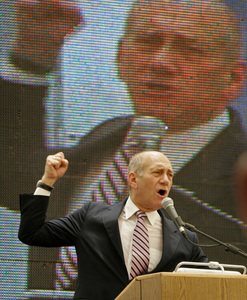 Israeli Prime Minister Ehud Olmert speaking at the opening ofa computer-chip manufacturing plant yesterday in Kiryat Gat.