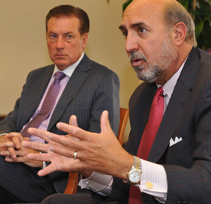 Possible merger partners Highmark CEO Kenneth R. Melani (left) and Independence Blue Cross CEO Joseph A. Frick pitched the health insurers' plan yesterday to the Inquirer Editorial Board.