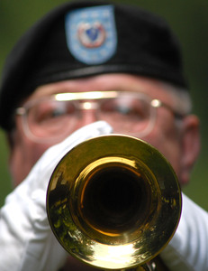 A bugler plays Taps at the funeral of Army Capt. Gregory T. Dalessio, a Cherry Hill native killed in Iraq.