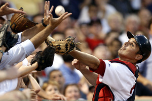 Red Sox catcher Kevin Cash can't get to a fifth-inning foul ball off the bat of the Twins' Carlos Gomez. Boston scored four runs in the eighth inning to earn the win.