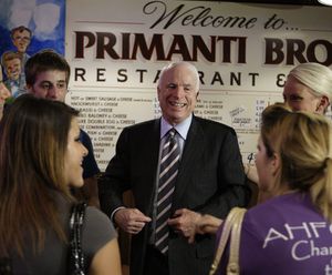 GOP presidential candidate John McCain, on a campaign stop, unbuttons his jacket, a must when you drop by Primanti's in Pittsburgh, famous for its huge sandwiches stuffed with french fries and cooked lunchmeat.