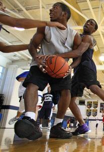 Vaughn Peterson (right) practices with Collingswood High School teammate Darnell McCargo. Peterson, 18, was visiting his grandmother, looking for a summer job, when he died.