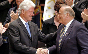 Former President Bill Clinton is welcomed by Gov. Rendell before speaking at the National Governors Association meeting in Philadelphia. Clinton said governors faced challenges similar to those of a century ago, including natural resources and inequality.