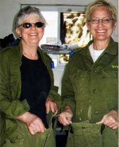 At an Israel Defense Forces base where they volunteered, author Debra Skaroff (left) and Bev Cohen model their work pants.