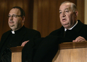 Louis A. DeNaples testifying before the Pennsylvania Gaming Control Board in Harrisburg in 2006, accompanied by the Rev. Joseph Sica, his friend.