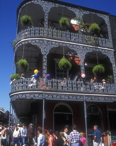 A building on Royal Street features Spanish architecture, including galleries, which are balconies supported by posts.