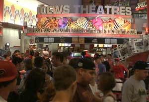 The crowd at the AMC Loews Cherry Hill 24 was duplicated at many area theaters where "The Dark Knight" opened at 12:01 a.m. yesterday. "It lived up to the hype," said one teen leaving the Cherry Hill cineplex afterward.