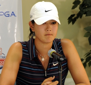 Michelle Wie speaks to reporters after being disqualified. She finished the third round in second after shooting a 5-under 67.