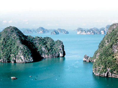 Cruises through Ha Long Bay, a UNESCO World Heritage site in the country&acute;s northeast, take visitors through hundreds of limestone islands. (Photo by Tom Steacy)