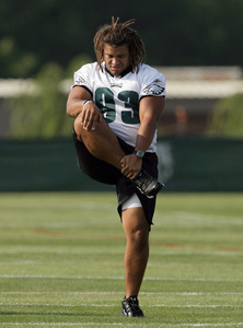 Top draft choice Trevor Laws stretches before practice on a field at Lehigh.