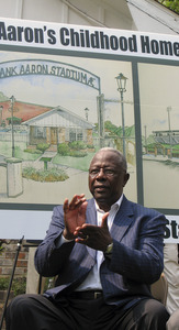 Hall of Famer Hank Aaron applauds plans to move his childhood home and convert it to a museum.