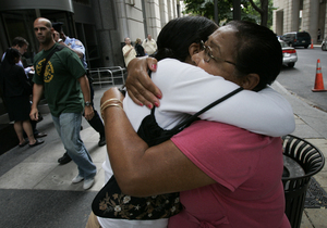 Embracing after a preliminary hearing, Mirta Rodriguez (left), mother of slain teen Mark Anthony Rivera, clings to her mother, Elba Jorge, outside the Criminal Justice Center yesterday.