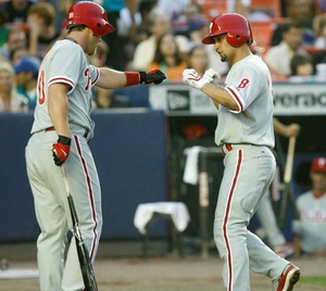 Shane Victorino (right) is greeted by Geoff Jenkins after hitting solo home run in second inning.