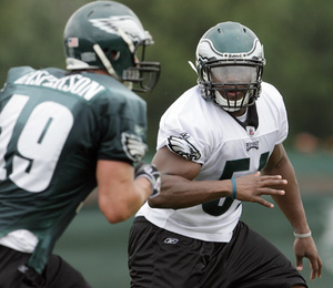 Joe Mays (right) follows wide receiver Michael Gasperson. A sixth-round pick, Mays looks forward to full-contact practices.<br />