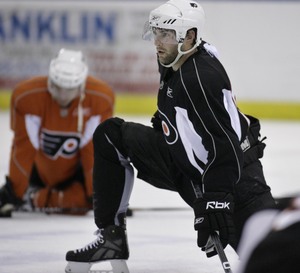 Flyers defenseman Ryan Parent, a rookie last season, stretches during prospect camp at the Skate Zone in Voorhees.