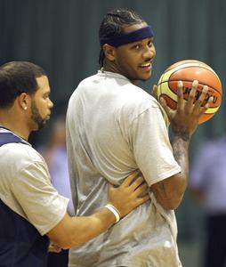 Carmelo Anthony (right) isn't guaranteeing gold this time.