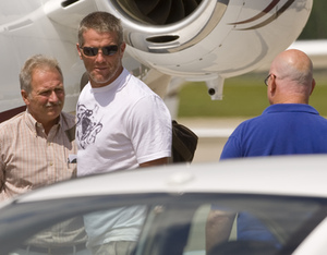 Brett Favre says farewell to friends as he leaves Green Bay for his home near Hattiesburg, Miss., in a private plane. His wife, Deanna, and his agent, James "Bus" Cook, traveled with him.