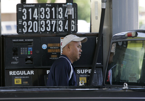 Bill Zurunz fills up at a gas station in Woodbury Heights, Gloucester County. With gasoline prices lower, will drivers in the region remain off the road or fall back into old habits?