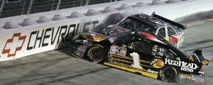 Martin Truex Jr. (1) spins out in front of A.J. Allmendinger during last night's Sharpie 500.