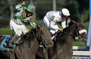 Garrett Gomez and Colonel John (right) win the Travers Stakes.