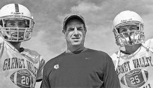 Garnet Valley coach Mike Ricci with star running backs Jared Bonacquisti (left) and Tim Keyser.