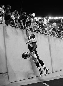 Eagles rookie linebacker Joe Mays leaps to high-five fan after Birds played Steelers at Heinz Field in Pittsburgh on Aug. 8.