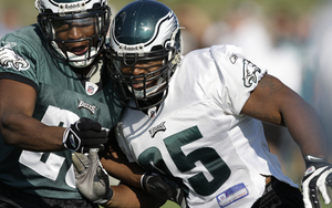 Jerome McDougle (right) tangles with Ryan Moats during training camp. Both were cut, but McDougle has found work.
