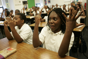 Celestine Ball, 10, counts during fifth-grade math class at KIPP Philadelphia Charter School, which started Aug. 11. The school has longer days and more days on the calendar.