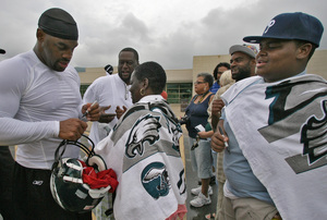 Donovan McNabb signs an autograph during training camp at Lehigh this summer.