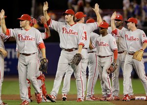It was high-fives all around after the Phillies defeated the Mets, 3-0, at Shea Stadium last night. Brett Myers got the win.