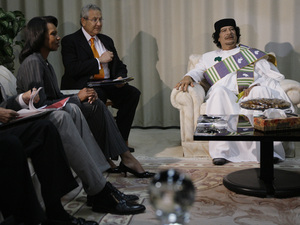 (right) and Condoleezza Rice meet in Tripoli. The State Departmentsays the high-level visit marks the opening of a new era in ties between theU.S. and the oil-rich country.