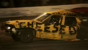 Mike Rommeney drives his yellow Chevy Cavalier, nicknamed "Cheesebox," in a demolition derby at a track in Riverhead, N.Y. Rommeney, the defending champion at the track, won the event.