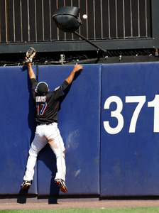 Mets' Fernando Tatis can't get Greg Dobbs' three-run homer in Phils' first game, a 6-2 win.The second game ended too late for this edition. Read about it online at http://www.philly.com/dailynews/