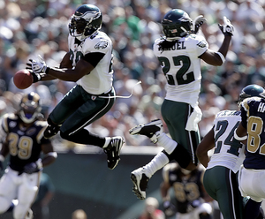 Eagles safety Brian Dawkins breaks up a pass intended for the Rams' Dante Hall in the second quarter.