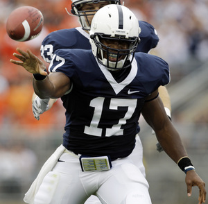 Penn State quarterback Daryll Clark tosses the football to an official after running for a first down against Oregon State.