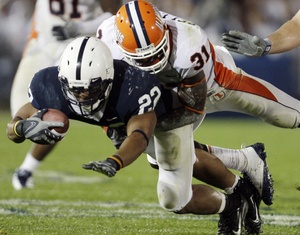 Penn State's Evan Royster is tackled by Illinois' Travon Bellamy. Joe Paterno says the Lions are close to being "really good."