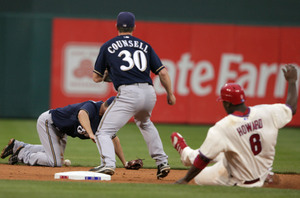 Brewers' J.J. Hardy can't find handle on ball hit by Eric Bruntlett in eighth. Ryan Howard was safe at second, Bruntlett was safe at first.