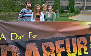 Burlington County College students Sean Parsons, Laura Dyer and Liz Lofton with associate dean Cathy Biggs (rear) prepare for Darfur-awareness events on campus.