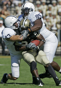 The Nittany Lions' Josh Hull (left) and Abe Koroma make Purdue running back Kory Sheets into a sandwich. Hull turned in the best game of his career to lead Penn State's defense Saturday.