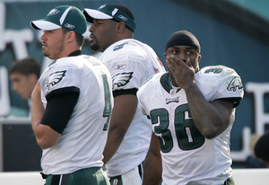 Kevin Kolb (left), Donovan McNabb and Brian Westbrook suffer through the final seconds of the Eagles' loss to the Redskins on Sunday. Westbrook appeared to break his ribs on the sixth play of the team's first possession.