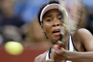 Venus Williams returns a shot to Flavia Pennetta of Italy at the Kremlin Cup in Moscow. "I just had a day where I could not control my game," Williams said after losing in three sets.