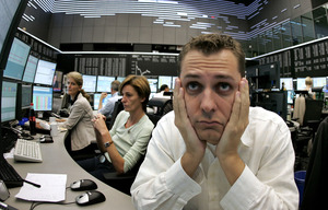 Brokers in Frankfurt, Germany, react as the stock market falls. Global financial turmoil led the Fed and central banks in England, China, Canada, Sweden and Switzerland and the European Central Bank to cut interest rates yesterday. 