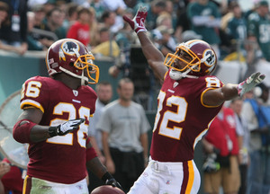 Redskins' Clinton Portis celebrates TD in fourth quarter, when Eagles defense sagged.