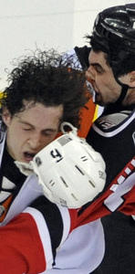 Randy Jones of the Flyers (left) duking it out with the Devils' Mike Mottau in March. Jones could be facing hip surgery.